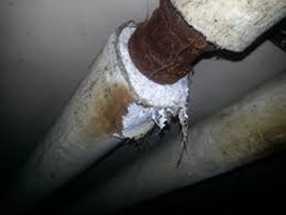 Picture showing asbestos insulation on an heating pipe